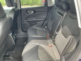 the back seats of a car are empty and the passenger seat is empty