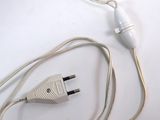 a white cord that is connected to a white plug