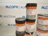 several cans of paint sitting on top of a table next to each other
