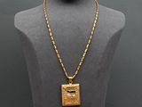 an image of a gold necklace on a mannequin mannequin