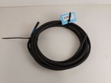 a black cable connected to a white cord on a white surface