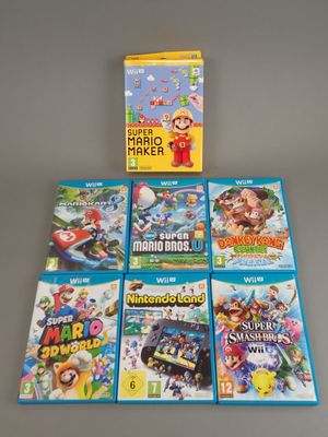 un lot de jeux Nintendo Wii posés sur une table