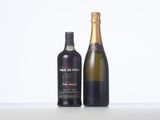 two bottles of wine sitting next to each other on a table