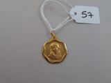 a close up of a gold medal on a string with a price tag