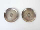 pair of silver plated bowls with a hole in the middle and a hole in the middle