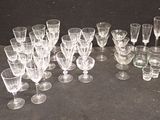 a lot of empty wine glasses sitting on a table