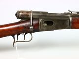 a close up of a rifle on a white surface with a white background