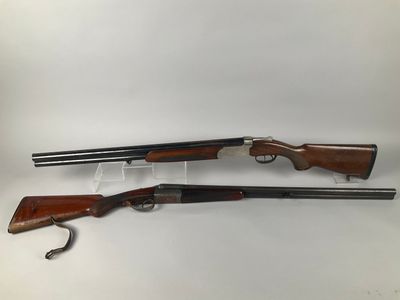 a pair of shotguns, one of which has been cleaned and the other has been cleaned