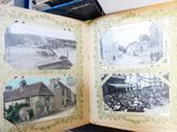 an open book with pictures of a town on it