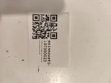 a qr code on a piece of paper on a table