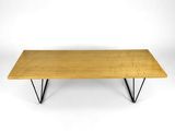 a wooden table with metal legs and a wooden top