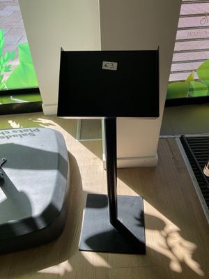 a table with a laptop on it in front of a window