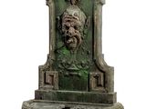 a statue of a man with a beard on a pedestal