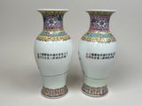 two vases that are sitting side by side on a table