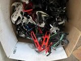a cardboard box full of assorted items on the floor