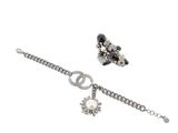 silver bracelet with a peace sign, flower and pearl charm