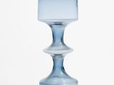 an image of a blue glass vase on a white background