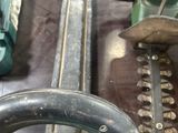 two chainsaws that are sitting next to each other