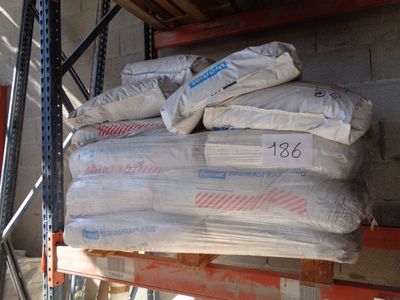 a large stack of bags on a shelf in a warehouse