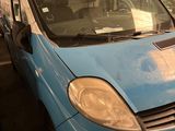 a blue van that is parked in a garage