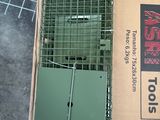 a box with a cage on top of it next to a pair of scissors