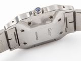 a close up of a wrist watch on a white surface