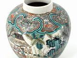 a vase with a design on it on a white surface