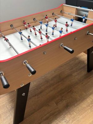 a foosball table in the corner of the room