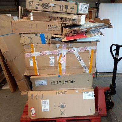 boxes stacked on top of each other on a pallet in a warehouse