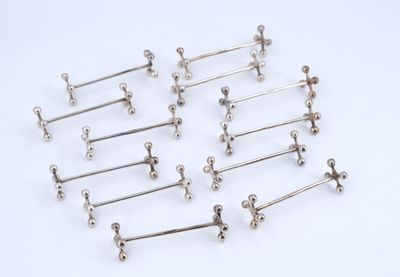 six pairs of silver barbells on a white background