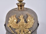 an old military hat with a gold eagle on it