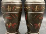 pair of antique japanese bronze vases with horses and samurais on them