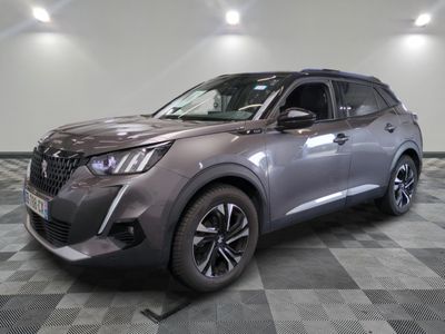 the front of a grey suv parked on a checkered floor