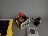 a game console and a game controller sitting on a table