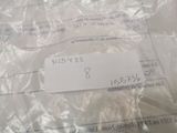 a white label on a plastic bag that is wrapped in plastic