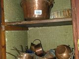 many pots and pans on the shelves in the kitchen