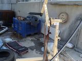 an image of a garage with a lot of junk on the ground