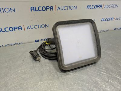 a close up of a light on a table with a cord