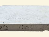 a close up of a piece of concrete with writing on it