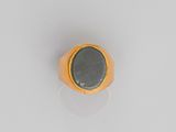 a close up of a gold ring with a black stone