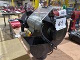a machine that is sitting on a table in a warehouse