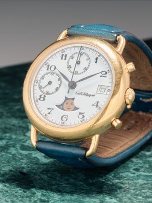 Emile PEQUIGNET Montre chronographe en métal doré et acier à…