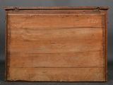 an old wooden box sitting on top of a table