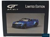 the box of the blue sports car is open and ready to be used