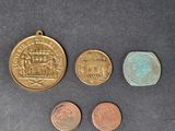 three different coins are shown next to each other on a table