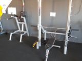 a picture of a gym room with equipment on the floor