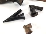 some old tools that are laying out on a white surface