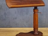 a small wooden table with a wooden top on a wooden floor