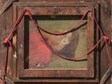 an image of a picture of a man in a red shirt is hanging on a wooden frame
