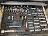 a tool box with tools in it sitting on a table
